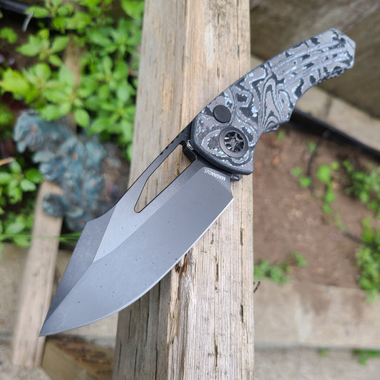 Heretic Knives Pariah Manual Black Magnacut White Camo Carbon Button Lock Folder