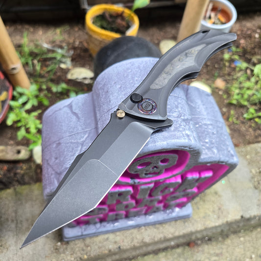 We Knife WE24054B-1 Tighe Down Titanium Black and Yellow CF M390 Flipper Button Lock Folder